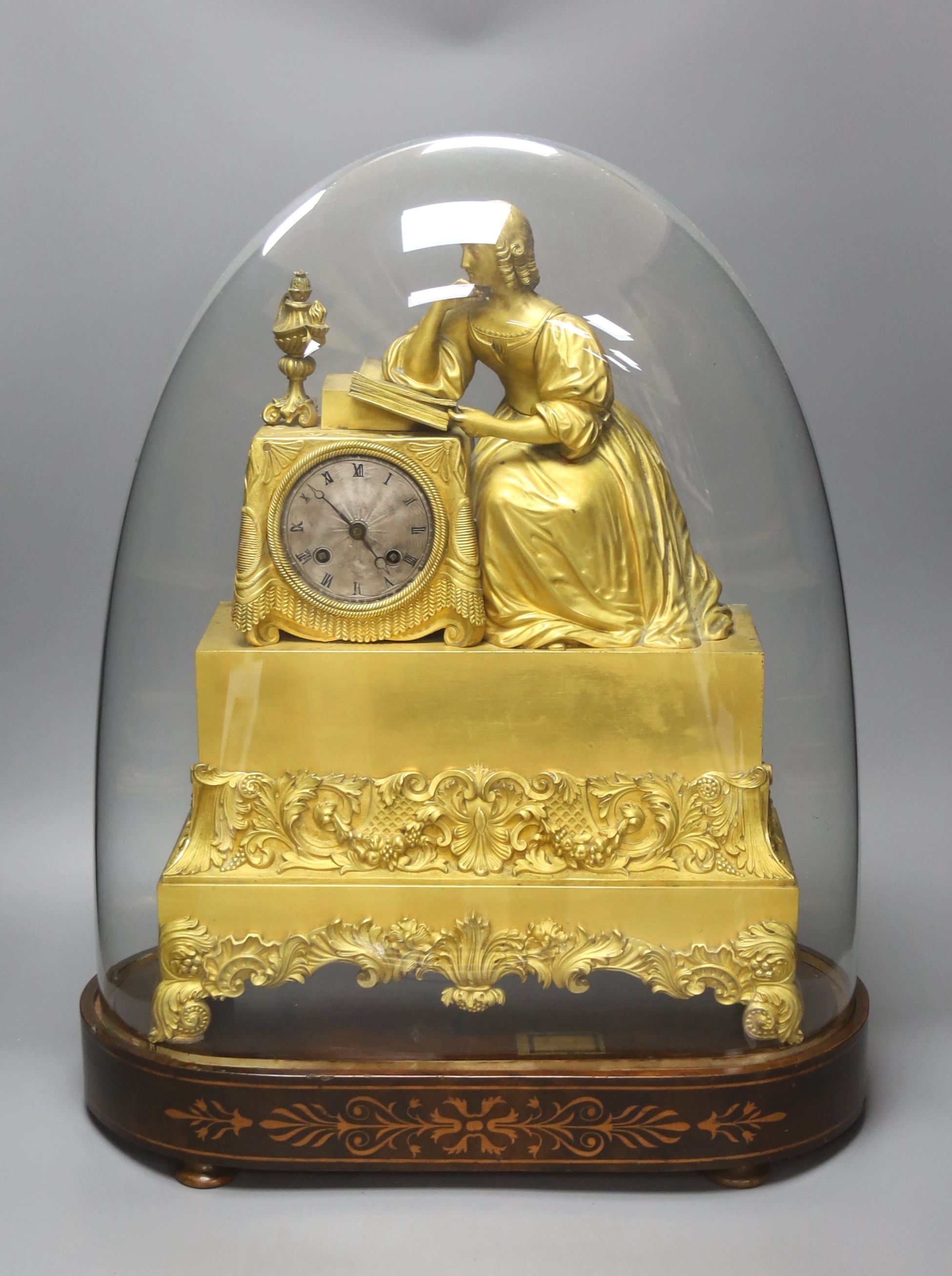 A 19th century French ormolu mantel clock (lacking pendulum), under glass dome and marquetry inlaid stand 54cm